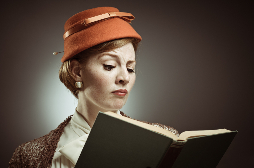 Women with hat reading book