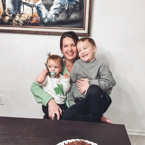 Mom sitting with two kids in her lap