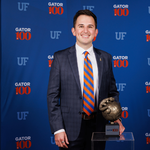 Steven Gallo accepting an award for the University of Florida's Gator 100