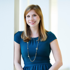 Headshot of Elizabeth Petit of Best Lawyers leaning against a white wall